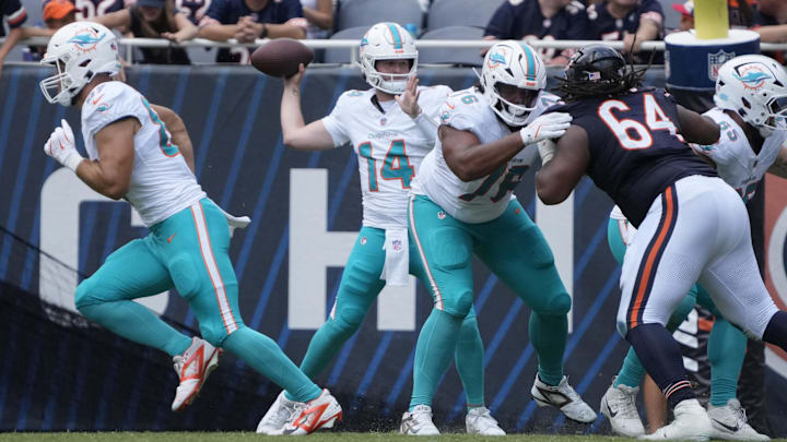 Aug 10, 2025; Chicago, Illinois, USA; Miami Dolphins quarterback Quinn Ewers (14) passes the ball against the Chicago Bears during the second half at Soldier Field. Mandatory Credit: David Banks-Imagn Images