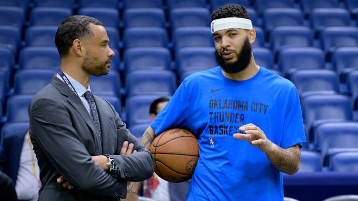 Mar 26, 2024; New Orleans, Louisiana, USA; Trajan Langdon, the general manager of the New Orleans Pelicans, left, talks with Oklahoma City Thunder forward Kenrich Williams (34) before a game at Smoothie King Center. Mandatory Credit: Matthew Hinton-Imagn Images Mar 26, 2024; New Orleans, Louisiana, USA; Trajan Langdon, the general manager of the New Orleans Pelicans, left, talks with Oklahoma City Thunder forward Kenrich Williams (34) before a game at Smoothie King Center. Mandatory Credit: Matthew Hinton-Imagn Images