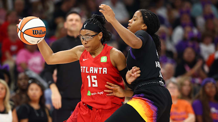 Aug 10, 2025; Phoenix, Arizona, USA; Atlanta Dream guard Allisha Gray (15) moves the ball against Phoenix Mercury guard Monique Akoa Makani (8) in the first half at Footprint Center. Mandatory Credit: Mark J. Rebilas-Imagn Images