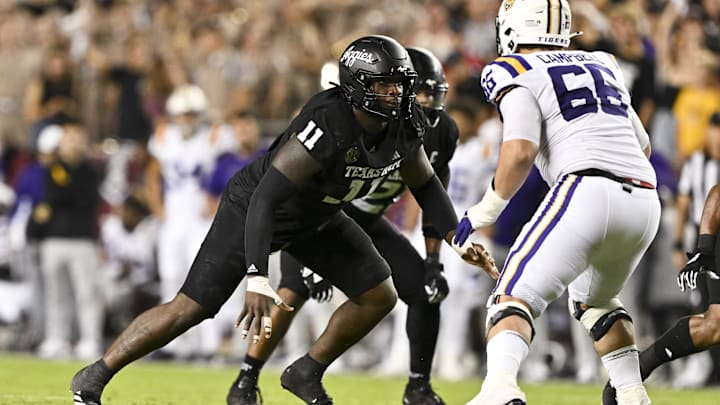 Oct 26, 2024; College Station, Texas, USA; Texas A&M Aggies defensive lineman Nic Scourton (11) defends in coverage against LSU Tigers offensive tackle Will Campbell (66) during the fourth quarter. The Aggies defeated the Tigers 38-23; at Kyle Field. Mandatory Credit: Maria Lysaker-Imagn Images.  