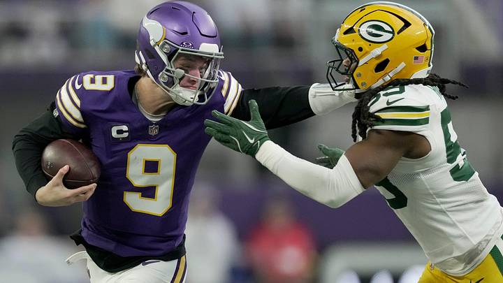 Minnesota Vikings quarterback J.J. McCarthy (9) stiff-arms Green Bay Packers linebacker Ty'Ron Hopper (59) after a seven yard run during the first quarter of their game Sunday, January 4, 2026 at U.S. Bank Stadium in Minneapolis, Minnesota. Minnesota Vikings quarterback J.J. McCarthy (9) stiff-arms Green Bay Packers linebacker Ty'Ron Hopper (59) after a seven yard run during the first quarter of their game Sunday, January 4, 2026 at U.S. Bank Stadium in Minneapolis, Minnesota.