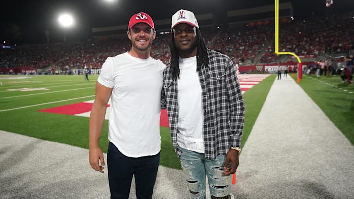 Oct 15, 2022; Fresno, California, USA; Las Vegas Raiders quarterback Derek Carr and wide receiver Davante Adams pose for a photo at halftime of the Fresno State Bulldogs vs San Jose State Spartans game at Valley Children's Stadium. Mandatory Credit: Cary Edmondson-Imagn Images