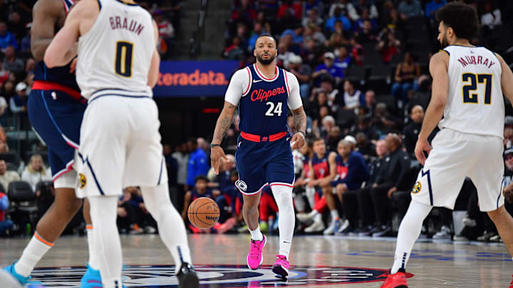 Apr 24, 2025; Inglewood, California, USA; Los Angeles Clippers guard Norman Powell (24) moves the ball against the Denver Nuggets during the second half of game three in the first round for the 2024 NBA Playoffs at Intuit Dome. Mandatory Credit: Gary A. Vasquez-Imagn Images Apr 24, 2025; Inglewood, California, USA; Los Angeles Clippers guard Norman Powell (24) moves the ball against the Denver Nuggets during the second half of game three in the first round for the 2024 NBA Playoffs at Intuit Dome. Mandatory Credit: Gary A. Vasquez-Imagn Images