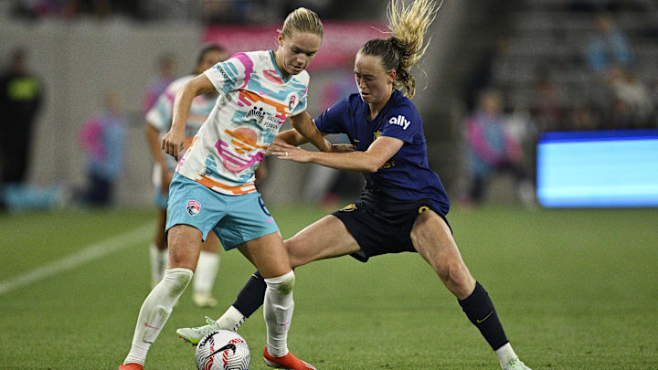 San Diego Wave FC defender Hanna Lundkvist (6) dribbles against Utah Royals FC defender Olivia Smith Griffits (3) during the second half at Snapdragon Stadium