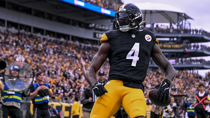 Oct 12, 2025; Pittsburgh, Pennsylvania, USA; Pittsburgh Steelers wide receiver DK Metcalf (4) makes a catch for a touchdown during the fourth quarter at Acrisure Stadium. Mandatory Credit: Barry Reeger-Imagn Images