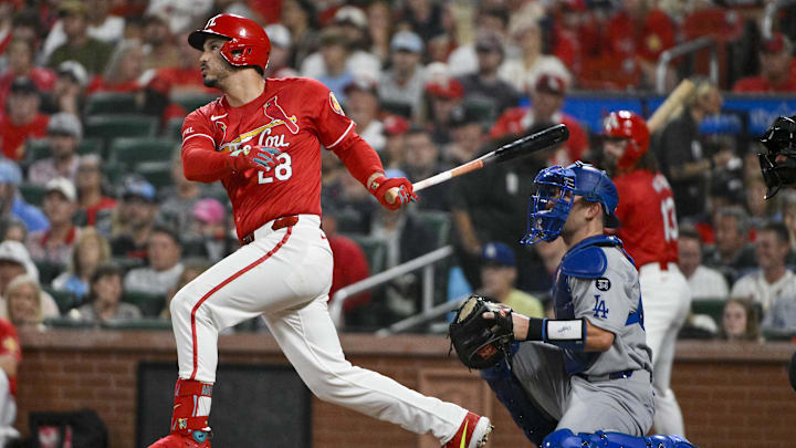 Jun 6, 2025; St. Louis, Missouri, USA;  St. Louis Cardinals third baseman Nolan Arenado (28) hits a single against the Los Angeles Dodgers during the second inning at Busch Stadium. Mandatory Credit: Jeff Curry-Imagn Images