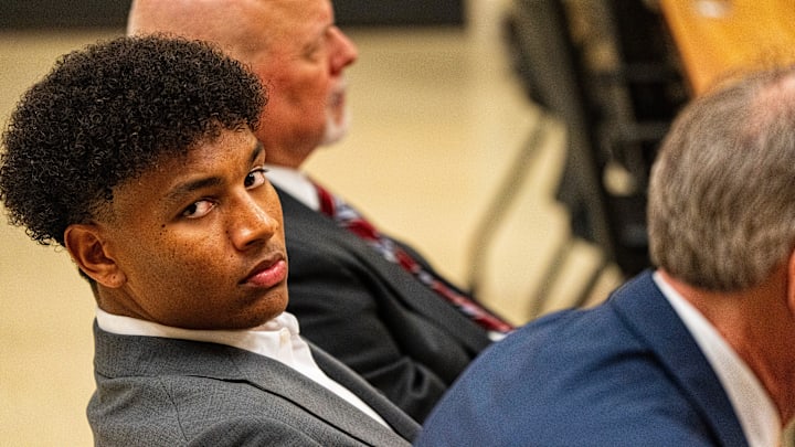 Ole Miss quarterback Trinidad Chambliss looks over at members of the press during the hearing of Chambliss in his lawsuit against the NCAA at Calhoun County Courthouse in Pittsboro, Miss., on Thursday, Feb. 12, 2026. Chambliss was granted a preliminary injunction against the NCAA.