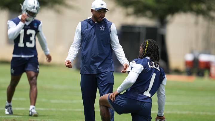 Dallas Cowboys defensive coordinator Christian Parker speaks with safety PJ Locke during practice at the Ford Center.