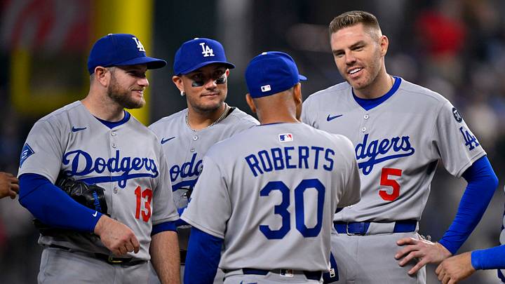 Apr 20, 2025; Arlington, Texas, USA; Los Angeles Dodgers third baseman Max Muncy (13) and second baseman Miguel Rojas (72) and manager Dave Roberts (30) and first baseman Freddie Freeman (5) during the game between the Texas Rangers and the Los Angeles Dodgers at Globe Life Field. Mandatory Credit: Jerome Miron-Imagn Images Apr 20, 2025; Arlington, Texas, USA; Los Angeles Dodgers third baseman Max Muncy (13) and second baseman Miguel Rojas (72) and manager Dave Roberts (30) and first baseman Freddie Freeman (5) during the game between the Texas Rangers and the Los Angeles Dodgers at Globe Life Field. Mandatory Credit: Jerome Miron-Imagn Images