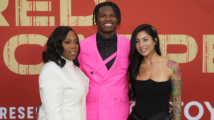 Then Colorado Buffaloes wide receiver Travis Hunter with his mother Ferrante Harris and his fiancee Leanna Lenee on the red carpet before the 2025 NFL Draft at Lambeau Field.