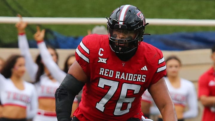 Oct 19, 2024; Lubbock, Texas, USA;  Texas Tech Red Raiders offensive tackle Caleb Rogers (76) blocks against the Baylor Bears in the first half at Jones AT&T Stadium and Cody Campbell Field. Mandatory Credit: Michael C. Johnson-Imagn Images