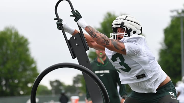 MSU's Isaac Smith works a sled, Tuesday, July 29, 2025, during the first day of football practice at the Skandalaris Football Center. MSU's Isaac Smith works a sled, Tuesday, July 29, 2025, during the first day of football practice at the Skandalaris Football Center.