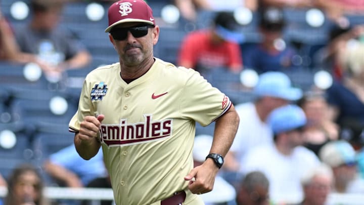 Jun 18, 2024; Omaha, NE, USA; Florida State Seminoles head coach Link Jarrett heads to the dugout before a game against the North Carolina Tar Heels at Charles Schwab Field Omaha. Mandatory Credit: Steven Branscombe-Imagn Images