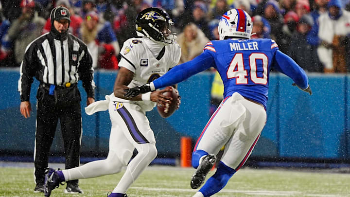 Baltimore Ravens quarterback Lamar Jackson scrambles looking for a player to pass to as Buffalo Bills linebacker Von Miller rushes towards him during first half action at the Buffalo Bills divisional game against the Baltimore Ravens at Highmark Stadium in Orchard Park on Jan. 19, 2025.