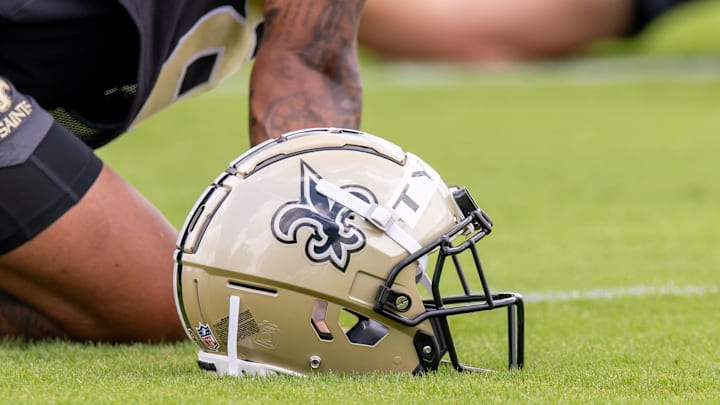 Jun 10, 2025; New Orleans, LA, USA; Detailed view of the Saints helmet during minicamp at Ochsner Sports Performance Center. Mandatory Credit: Stephen Lew-Imagn Images Jun 10, 2025; New Orleans, LA, USA; Detailed view of the Saints helmet during minicamp at Ochsner Sports Performance Center. Mandatory Credit: Stephen Lew-Imagn Images
