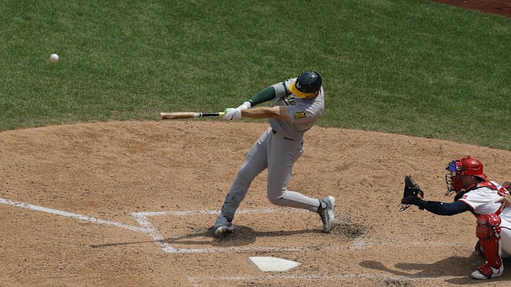 Aug 7, 2025; Washington, District of Columbia, USA; Athletics outfielder Tyler Soderstrom (21) hits a solo home run against the Washington Nationals during the eighth inning at Nationals Park. Mandatory Credit: Geoff Burke-Imagn Images