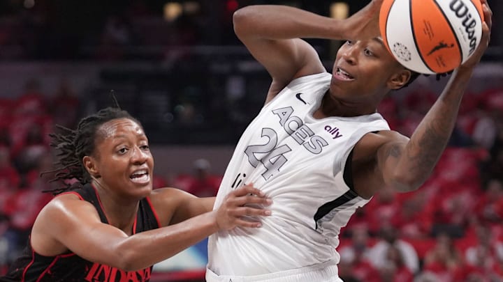 Las Vegas Aces guard Jewell Loyd (24) is defended by Indiana Fever guard Kelsey Mitchell (0) during Game 4 of the WNBA semifinals on Sunday, Sept. 28, 2025, at Gainbridge Fieldhouse in Indianapolis. The Fever defeated the Aces 90-83.