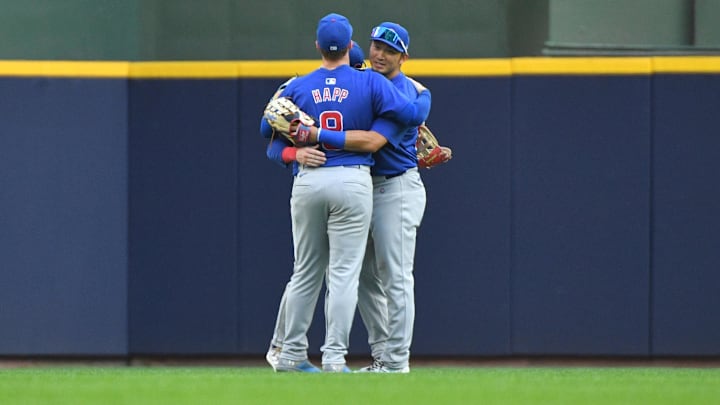 Jun 29, 2024; Milwaukee, Wisconsin, USA; Chicago Cubs outfielder Ian Happ (8), Chicago Cubs outfielder Pete Crow-Armstrong (52) and Chicago Cubs outfielder Seiya Suzuki (27) celebrate a 5-3 win over the Milwaukee Brewers at American Family Field. Mandatory Credit: Michael McLoone-Imagn Images
