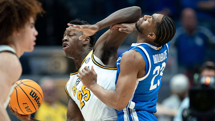 Missouri forward Mark Mitchell (25) works against Kentucky forward Mouhamed Dioubate (23) during their Day 2 2026 SEC Men’s Basketball Tournament game at Bridgestone Arena in Nashville, Tenn., Thursday, March 12, 2026.