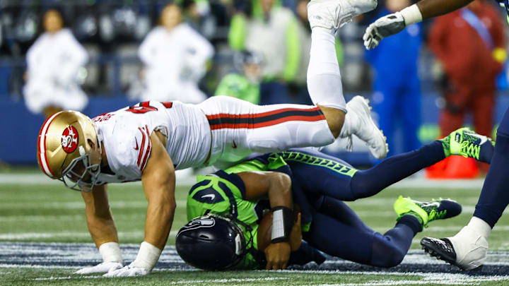 Dec 15, 2022; Seattle, Washington, USA; San Francisco 49ers defensive end Nick Bosa (97) sacks Seattle Seahawks quarterback Geno Smith (7) during the fourth quarter at Lumen Field. Mandatory Credit: Joe Nicholson-Imagn Images Dec 15, 2022; Seattle, Washington, USA; San Francisco 49ers defensive end Nick Bosa (97) sacks Seattle Seahawks quarterback Geno Smith (7) during the fourth quarter at Lumen Field. Mandatory Credit: Joe Nicholson-Imagn Images