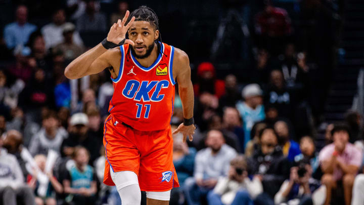 Apr 7, 2024; Charlotte, North Carolina, USA; Oklahoma City Thunder guard Isaiah Joe (11) celebrates a three point basket against the Charlotte Hornets during the fourth quarter at Spectrum Center. Mandatory Credit: Scott Kinser-USA TODAY Sports