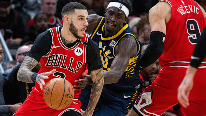 Jan 8, 2025; Indianapolis, Indiana, USA; Chicago Bulls guard Lonzo Ball (2) dribbles the ball while Indiana Pacers forward Pascal Siakam (43) defends in the first half at Gainbridge Fieldhouse. Mandatory Credit: Trevor Ruszkowski-Imagn Images