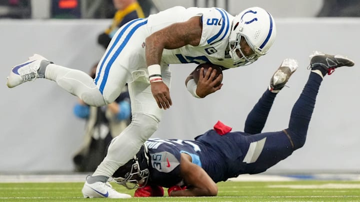 Indianapolis Colts quarterback Anthony Richardson (5) works to get past Tennessee Titans cornerback Daryl Worley (35) on Sunday, Dec. 22, 2024, during a game against the Tennessee Titans at Lucas Oil Stadium in Indianapolis.
