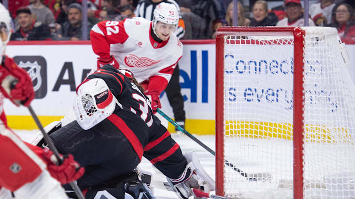 Jan 5, 2026; Ottawa, Ontario, CAN; Detroit Red Wings center Marco Kasper (92) shoots on Ottawa Senators goalie Hunter Shepard (31) in the second period at the Canadian Tire Centre. Mandatory Credit: Marc DesRosiers-IMAGN Images