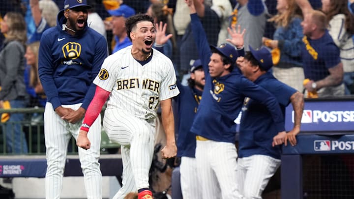 Oct 3, 2024; Milwaukee, Wisconsin, USA; Milwaukee Brewers shortstop Willy Adames (27) reacts to Milwaukee Brewers outfielder Sal Frelick (10) home run on a fly ball to right field during the seventh inning of Game 3 of National League wild-card series against the New York Mets on Thursday October 3, 2024 at American Family Field in Milwaukee, Wis. Mandatory Credit: Jovanny Hernandez/USA TODAY Network via Imagn Images