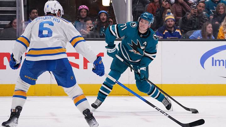 Mar 6, 2026; San Jose, California, USA; San Jose Sharks center Macklin Celebrini (71) scores a goal against while defended by St. Louis Blues defenseman Philip Broberg (6) in the second period at SAP Center at San Jose. Mandatory Credit: David Gonzales-Imagn Images