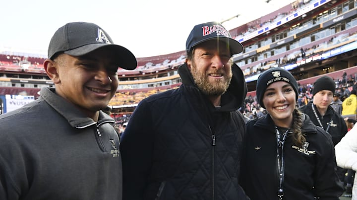 Dec 14, 2024; Landover, Maryland, USA;  Dave Portnoy poses with solders before the between the Army Black Knights and the Navy Midshipmen  at Commanders Field. Mandatory Credit: Tommy Gilligan-Imagn Images