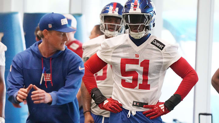 Outside linebackers coach Charlie Bullen with first-round draft pick Abdul Carter during practice at Giants Rookie Minicamp.