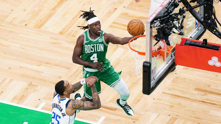Jun 17, 2024; Boston, Massachusetts, USA; Boston Celtics guard Jrue Holiday (4) shoots against Dallas Mavericks forward P.J. Washington (25) in the third quarter during game five of the 2024 NBA Finals at TD Garden. Mandatory Credit: David Butler II-USA TODAY Sports