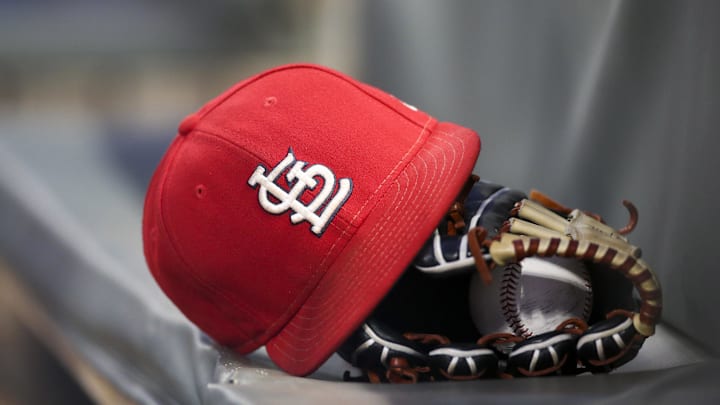 Sep 17, 2018; Atlanta, GA, USA; Detailed view of a St. Louis Cardinals hat and glove in the dugout against the Atlanta Braves in the first inning at SunTrust Park. Mandatory Credit: Brett Davis-Imagn Images
Sep 17, 2018; Atlanta, GA, USA; Detailed view of a St. Louis Cardinals hat and glove in the dugout against the Atlanta Braves in the first inning at SunTrust Park. Mandatory Credit: Brett Davis-Imagn Images