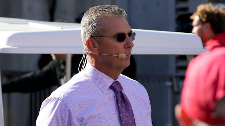Oct 21, 2023; Columbus, Ohio, USA; Former Ohio State Buckeye football coach Urban Meyer walks to the Big Noon Kickoff show set before the Penn State Nittany Lions game at Ohio Stadium.