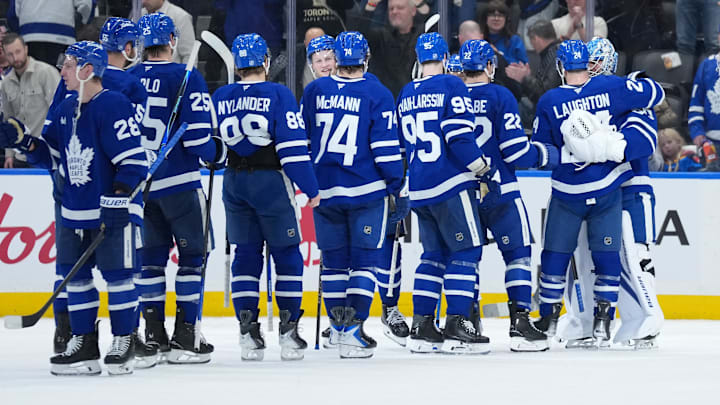 Jan 10, 2026; Toronto, Ontario, CAN; Toronto Maple Leafs goaltender Joseph Woll (60) celebrates the win with center Scott Laughton (24) against the Vancouver Canucks at the end of the third period at Scotiabank Arena. Mandatory Credit: Nick Turchiaro-Imagn Images