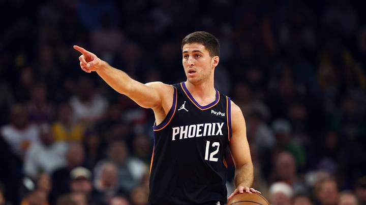 Dec 23, 2025; Phoenix, Arizona, USA; Phoenix Suns guard Collin Gillespie (12) against the Los Angeles Lakers at Mortgage Matchup Center. Mandatory Credit: Mark J. Rebilas-Imagn Images