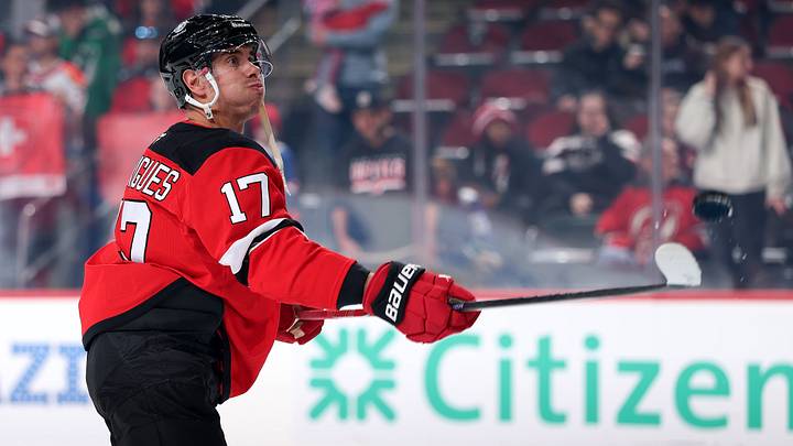 Evan Rodrigues plays with the puck prior to his contest with the Vancouver Canucks