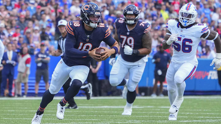 Aug 10, 2024; Orchard Park, New York, USA; Chicago Bears quarterback Caleb Williams (18) runs with the ball against the Buffalo Bills during the first half at Highmark Stadium. Mandatory Credit: Gregory Fisher-Imagn Images