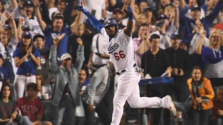 Oct 27, 2018; Los Angeles, CA, USA; Los Angeles Dodgers outfielder Yasiel Puig (66) celebrates after hitting a three-run home run off of Boston Red Sox pitcher Eduardo Rodriguez (not pictured) in the sixth inning in game four of the 2018 World Series at Dodger Stadium. Mandatory Credit: Robert Hanashiro-Imagn Images