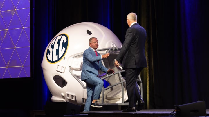 Jul 15, 2024; Dallas, TX, USA; LSU head coach Brian Kelly shakes hands with SEC commissioner Greg Sankey speaking at Omni Dallas Hotel. Mandatory Credit: Brett Patzke-USA TODAY Sports