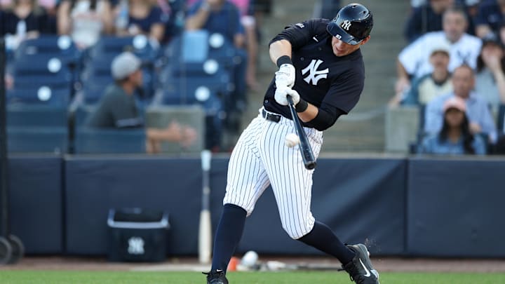 Mar 14, 2025; Tampa, Florida, USA; New York Yankees first baseman Ben Rice (93) hits a two-run home run against the Philadelphia Phillies in the second inning during spring training at George M. Steinbrenner Field.