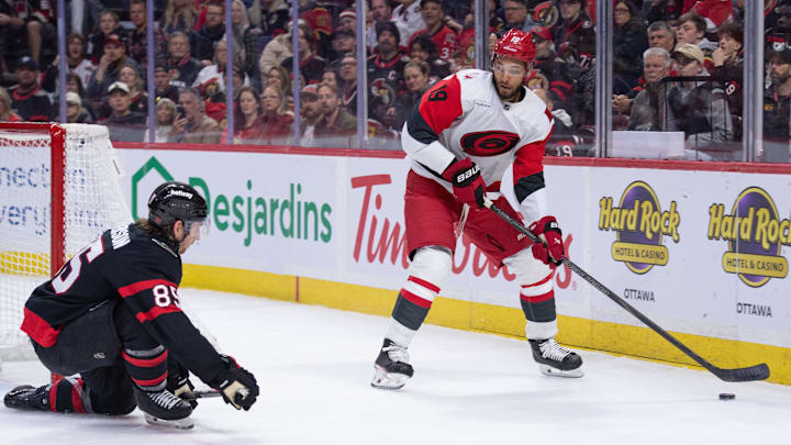 Apr 5, 2026; Ottawa, Ontario, CAN; Carolina Hurricanes defenseman K'Andre Miller (19) skates with the puck as Ottawa Senators defenseman Jake Sandreson (85) gets in position to block in the second period at the Canadian Tire Centre. Mandatory Credit: Marc DesRosiers-IMAGN Images