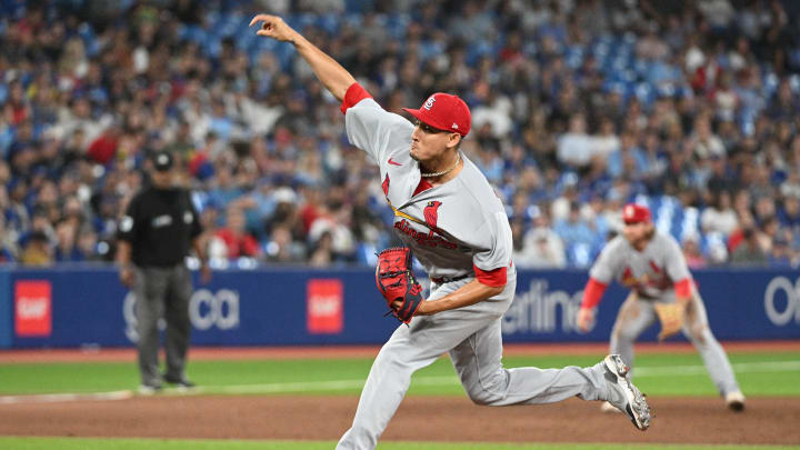Jul 27, 2022; Toronto, Ontario, CAN;  St. Louis Cardinals relief pitcher Giovanny Gallegos (65) delivers a pitch against the Toronto Blue Jays in the eighth inning at Rogers Centre. Mandatory Credit: Dan Hamilton-USA TODAY Sports