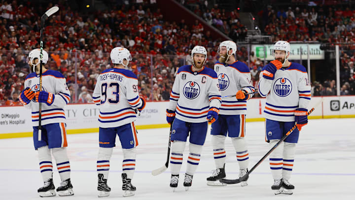Edmonton Oilers forward Connor McDavid (97) and forward Ryan Nugent-Hopkins (93) and forward Zach Hyman (18) await the face off