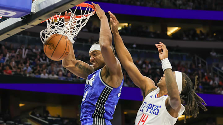 Orlando Magic center Wendell Carter Jr. (34) dunks in front of LA Clippers guard Terance Mann (14) during the second quarter at KIA Center.