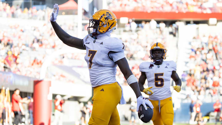 Nov 30, 2024; Tucson, Arizona, USA; Arizona State Sun Devils tight end Chamon Metayer (7) waves to the fans as he celebrates a touchdown against the Arizona Wildcats during the Territorial Cup at Arizona Stadium. Mandatory Credit: Mark J. Rebilas-Imagn Images