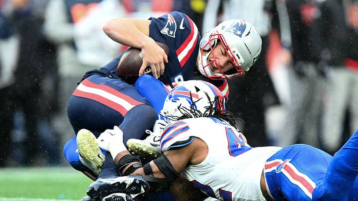 Dec 14, 2025; Foxborough, Massachusetts, USA; New England Patriots quarterback Drake Maye (10) is sacked by Buffalo Bills linebacker Matt Milano (58) during the second half at Gillette Stadium. Mandatory Credit: Brian Fluharty-Imagn Images