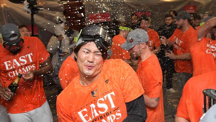 Baltimore Orioles relief pitcher Shintaro Fujinami (14) celebrates  in the locker room after defeating the Boston Red Sox to become A.L. Champs at Oriole Park at Camden Yards in 2023.