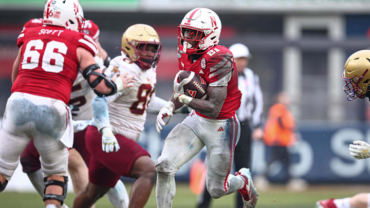 Emmett Johnson carries the ball for Nebraska during the 2024 Pinstripe Bowl.